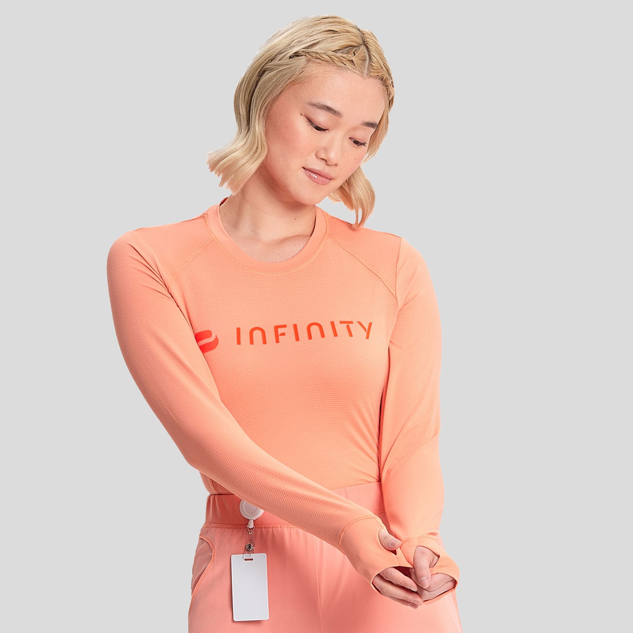 IN_INFINITY_GNR8_LOGOPERFORMANCEUNDERSCRUB_641_ELECTRICCORAL_RIGHT2